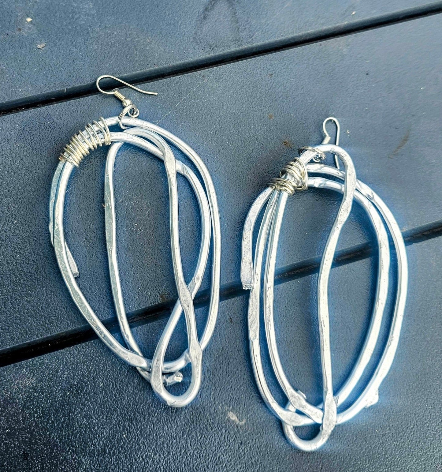 Big silver plated earrings.